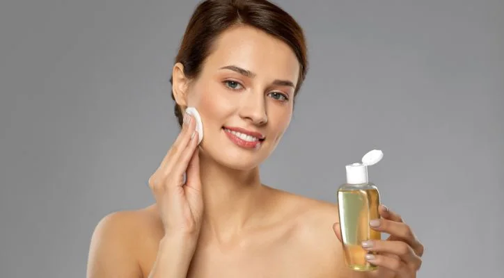 women applying body toner