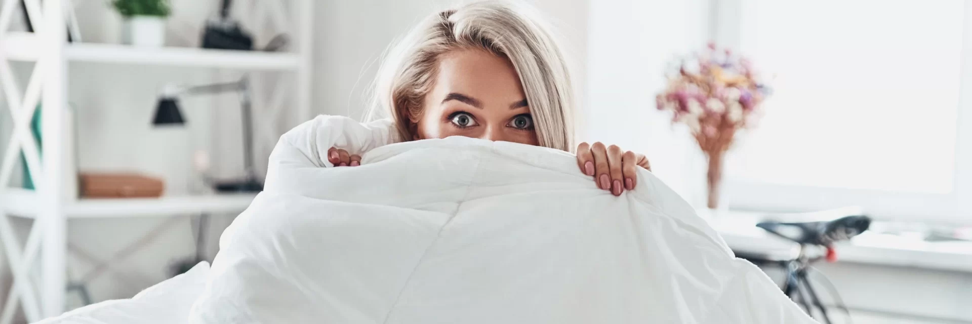 woman under her blanket