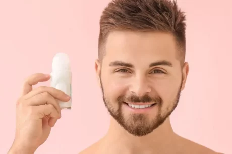man handling skin care product