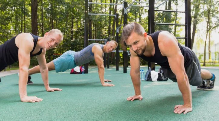 group of people doing push ups