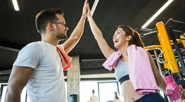 man and woman in the gym