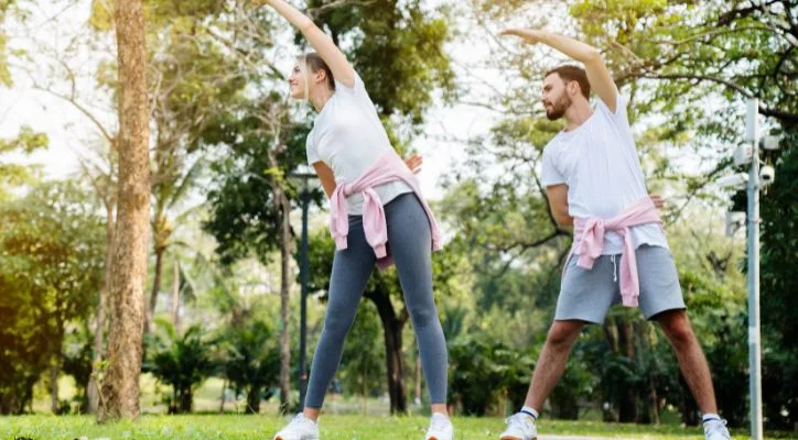 man and woman stretching